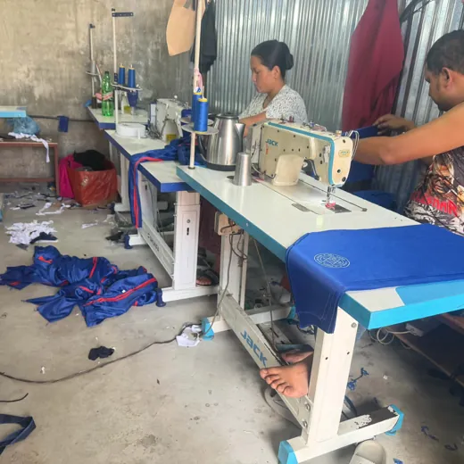 Bulk school uniforms at the Shulav factory in Kathmandu